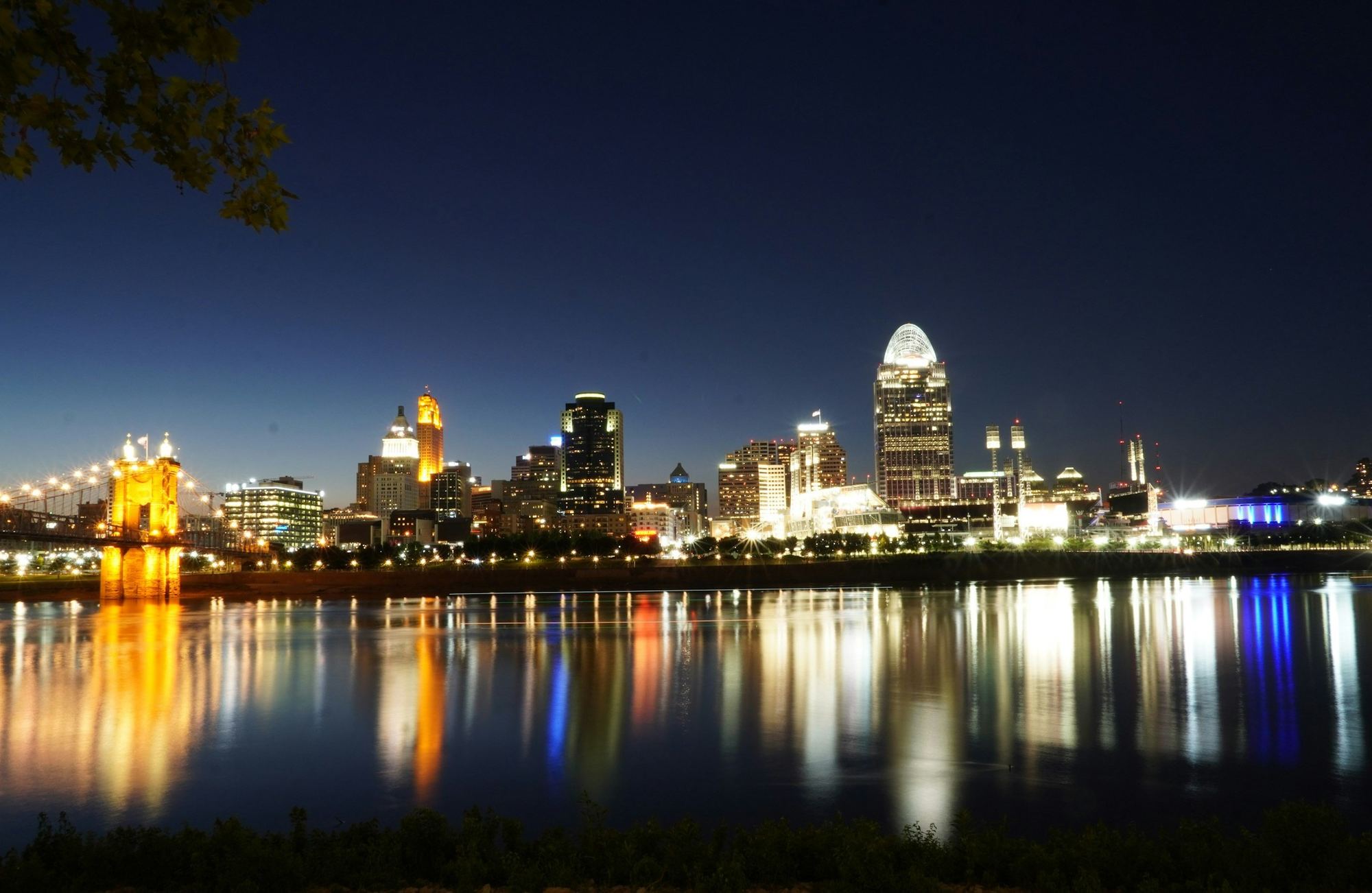 The Cincinnati skyline and the Roebling Bridge over the Ohio River at dusk